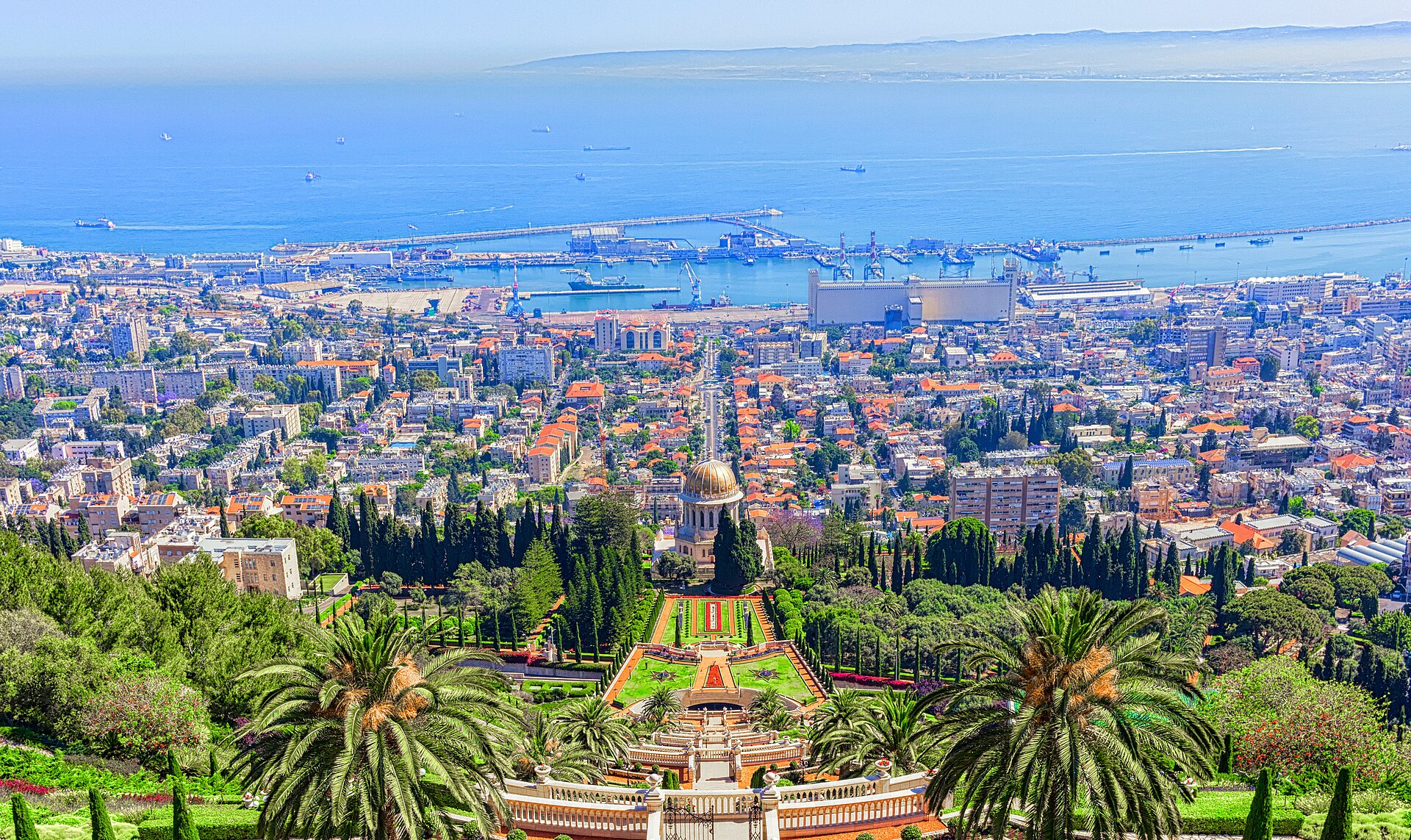 Bright daytime view over the Baha'i Gardens, Haifa bay and port